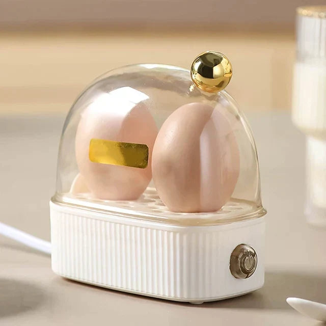 Vintage-style compact electric egg cooker in green, a quick and perfect breakfast maker for any kitchen.