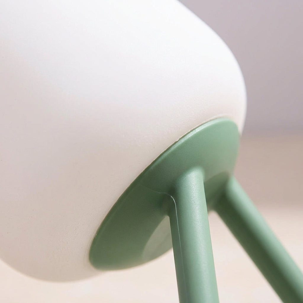 Compact LED Night Lamp on a nightstand, providing a gentle glow for a bedroom, ideal for reading or subtle home decor