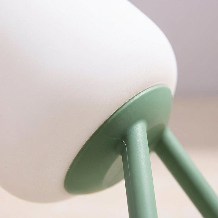 Compact LED Night Lamp on a nightstand, providing a gentle glow for a bedroom, ideal for reading or subtle home decor