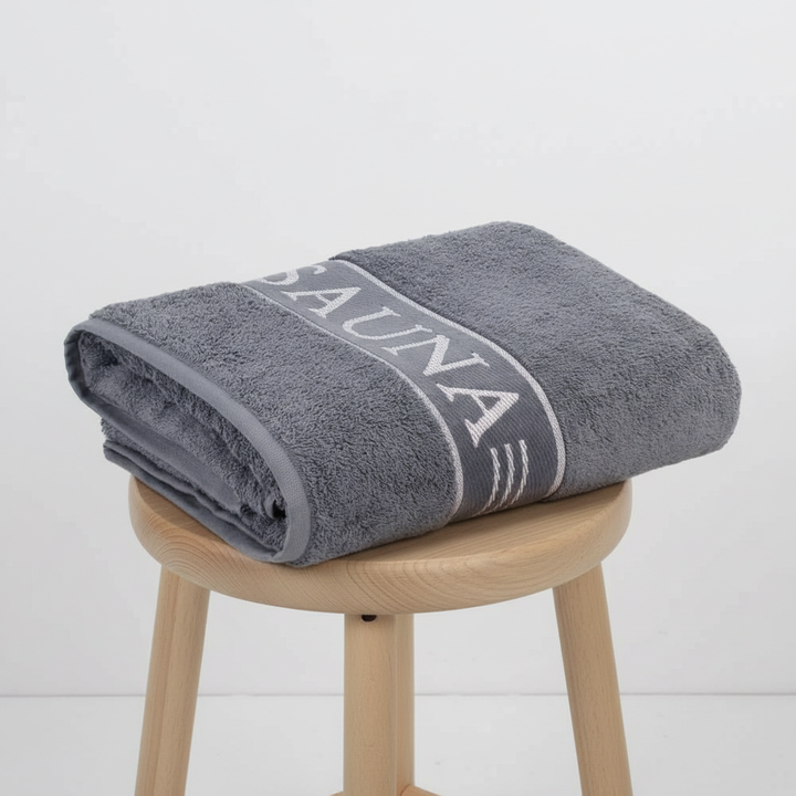 Freshly washed white SaunaEssence cotton towel, clean, Oeko-Tex certified, soft for sauna & spa