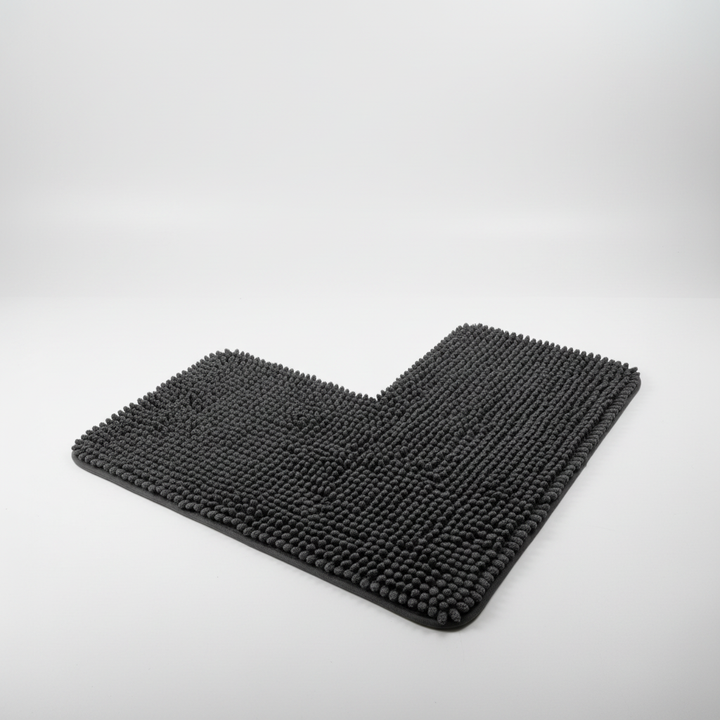 Folded L-shaped corner bath mat, highlighting its soft fabric and machine washable feature for convenience.
