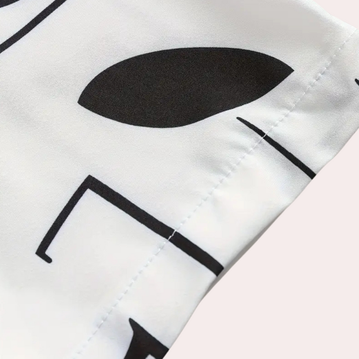 A classic white button-down shirt for men, offering a comfortable fit and versatile style.
