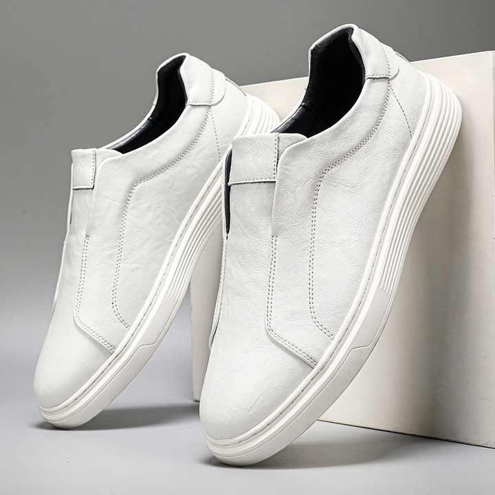 Men's classic white sneakers for versatile everyday style. Comfortable low-top design.