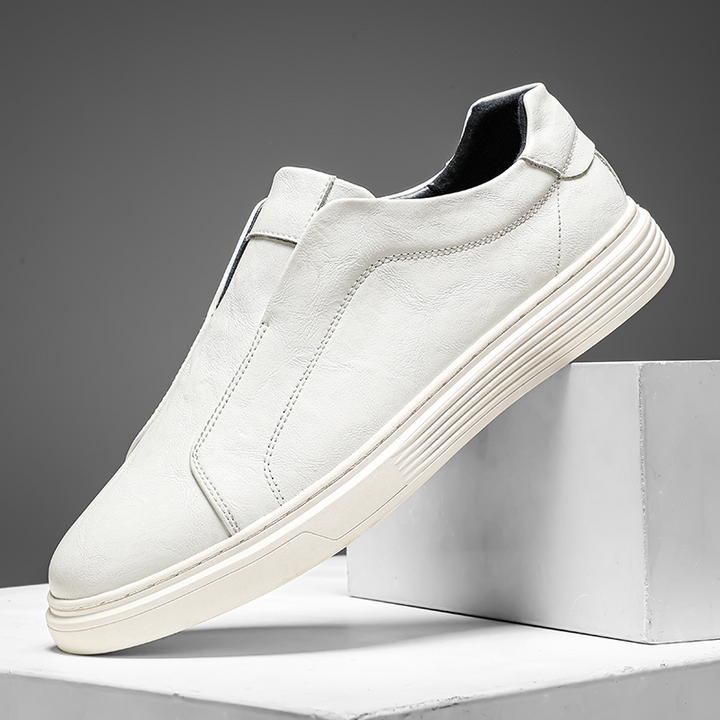 Black low-top mens sneakers. Hand-finished for stylish, comfortable everyday wear.