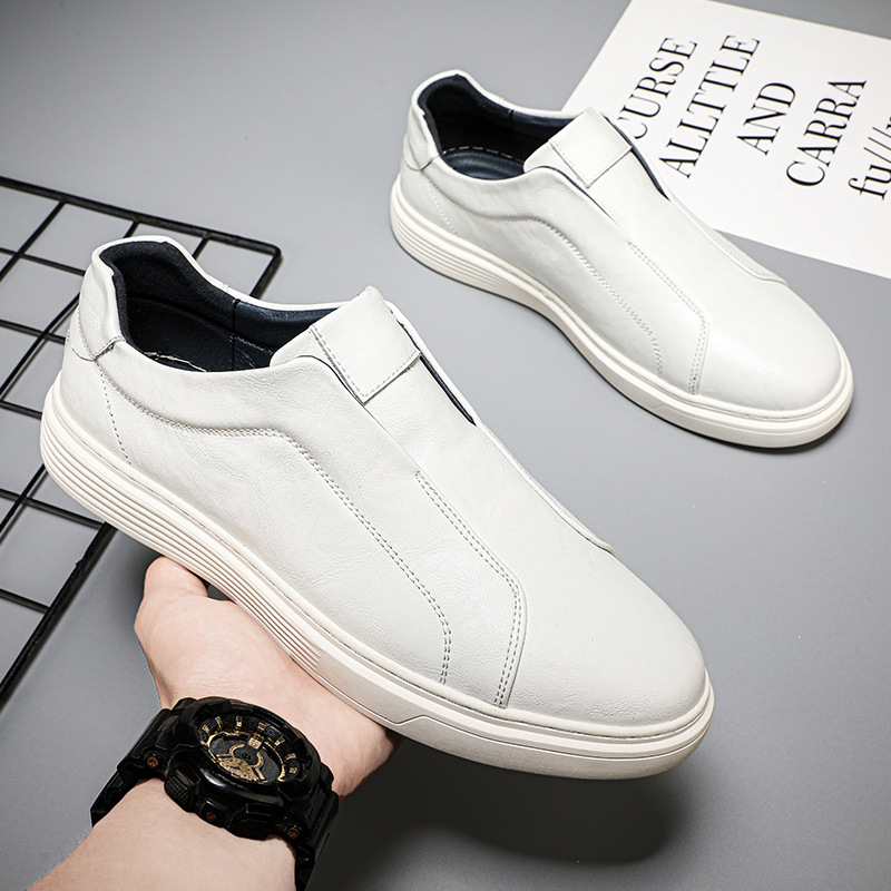 Comfortable white mens low-top footwear. Everyday classic style sneakers.
