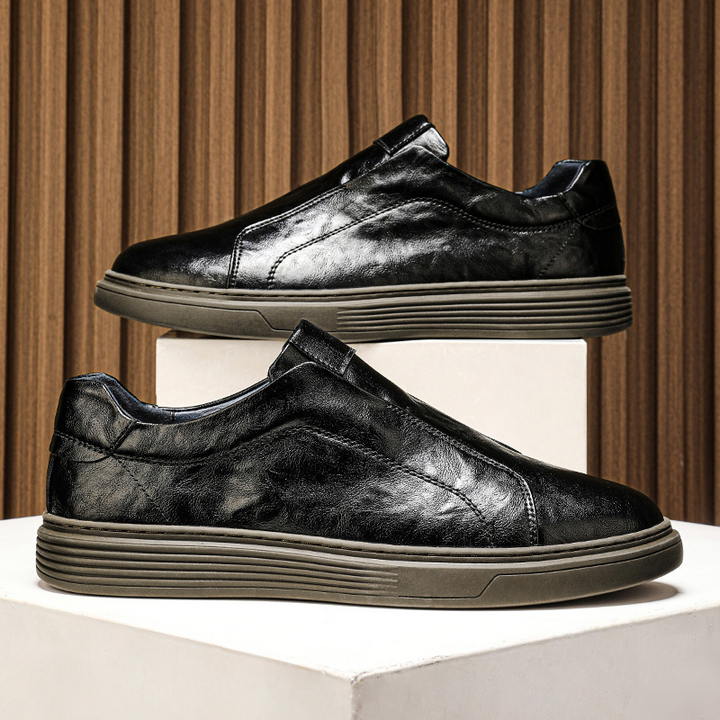 Hand-finished black men's everyday sneakers. Stylish low-top, versatile design.