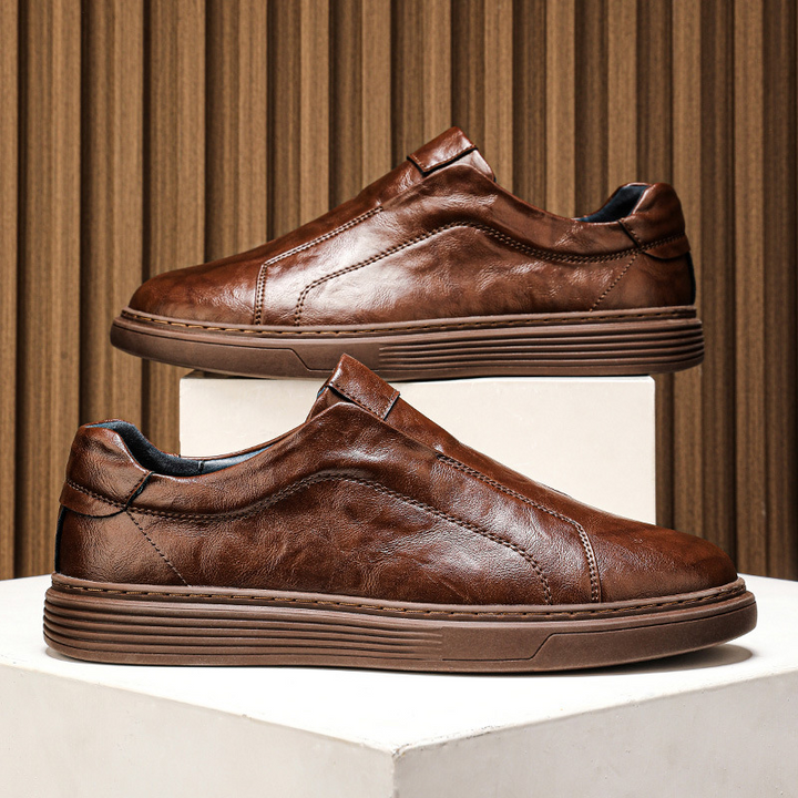 Comfortable white mens sneakers, classic low-top design for everyday wear.