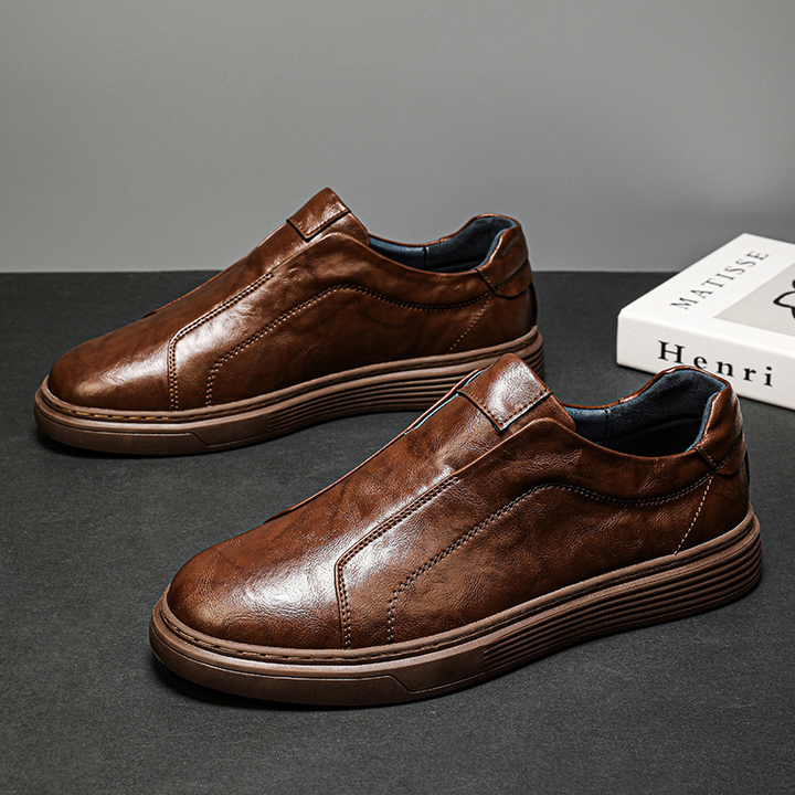 Men's everyday white low-top sneakers. Classic comfortable footwear for casual style.
