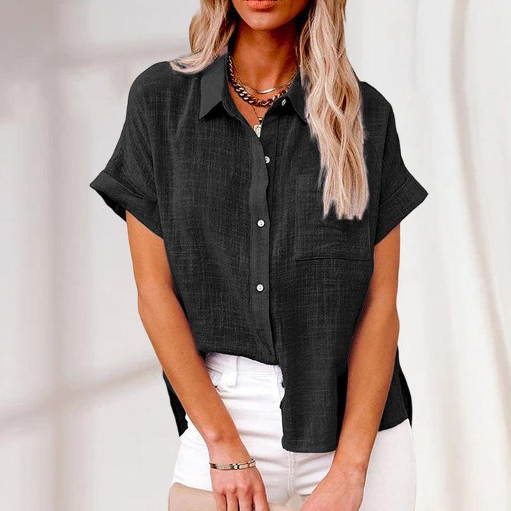 Casual women's button-up shirt with short sleeves, ideal for warm weather due to its lightweight fabric.