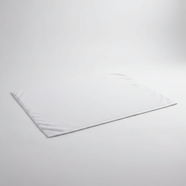 Folded SoftStepMat non-slip bath mat, showcasing its plush cotton material and readiness for use in any home
