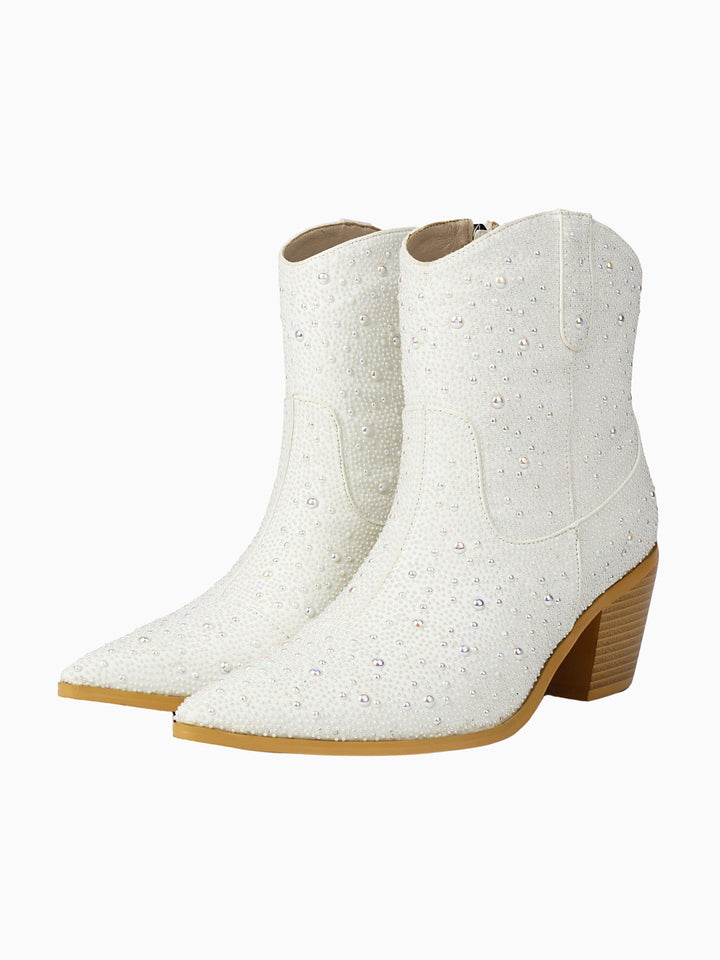 White women's cowgirl boots with pearl and rhinestone embellishments, perfect for a bridal or western wedding.