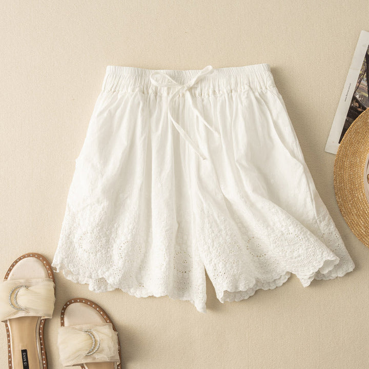 White women's lightweight drawstring shorts with delicate lace trim, perfect for summer casual wear & vacation.