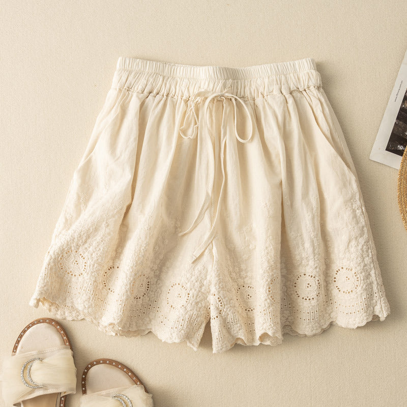 Beige relaxed fit women's shorts featuring comfy drawstring waist & elegant lace details. Ideal for summer.