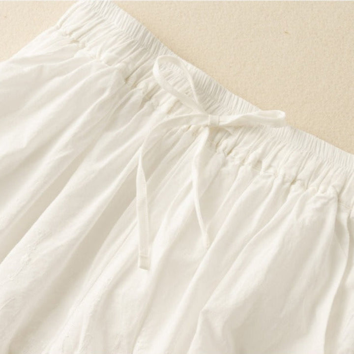 Lightweight women's drawstring shorts with stylish lace trim for a relaxed, comfortable summer look.