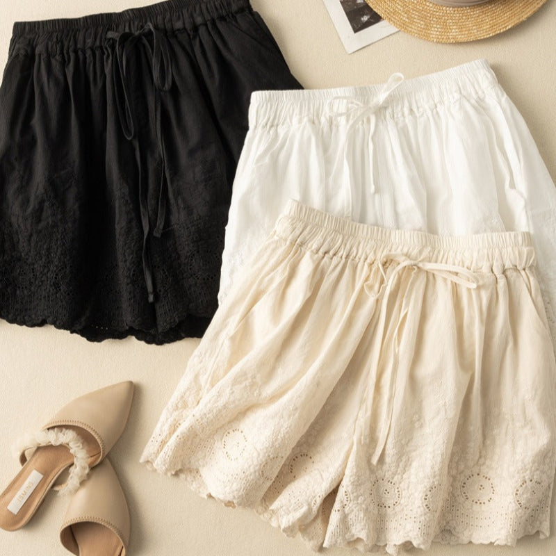 Relaxed fit women's casual shorts with adjustable drawstring and feminine lace trim. Perfect summer essential.