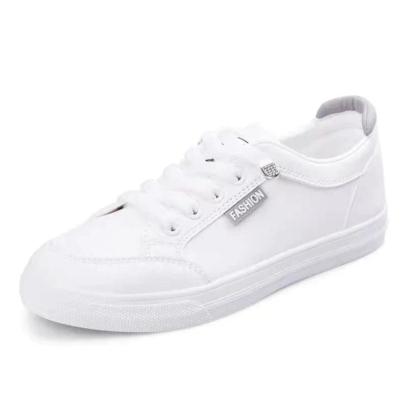 White women's UrbanEase Low tennis sneakers, orthopedic support for comfort, ideal for casual & athletic wear.