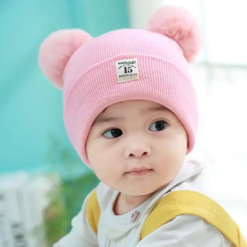 Unisex knitted beanie for toddlers, light blue with a fun pom-pom, warm cotton accessory