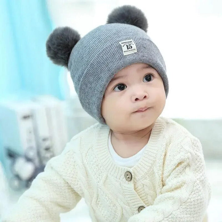 Kids winter hat: cozy knitted beanie in red with a large pom-pom, ideal cold weather gear