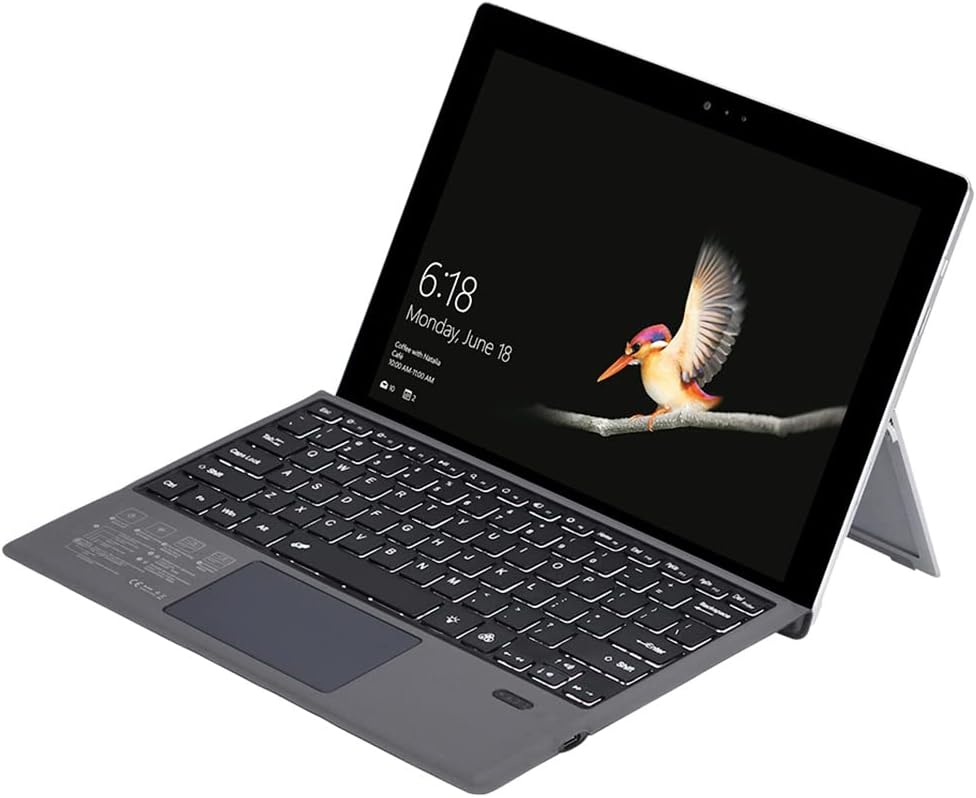 Close-up of Nexora wireless keyboard's backlit keys and responsive touchpad for Surface Pro