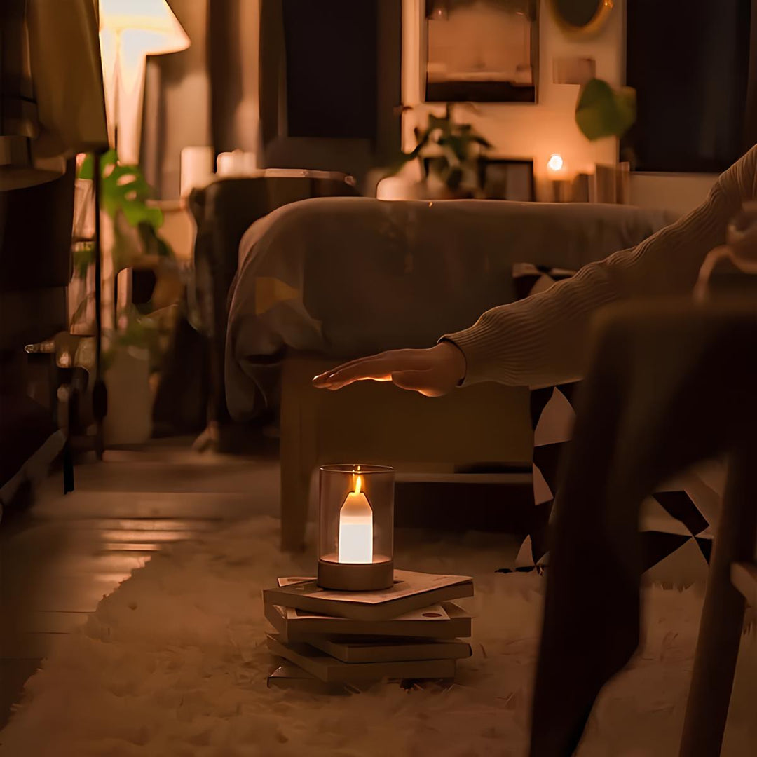 Set of two LumiCandle wireless LED lamps on a dining table, creating warm light atmosphere