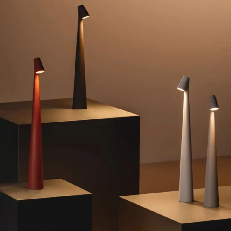 Minimalist Nordic LED table lamp, creating dimmable mood lighting. Cordless and modern for home decor.