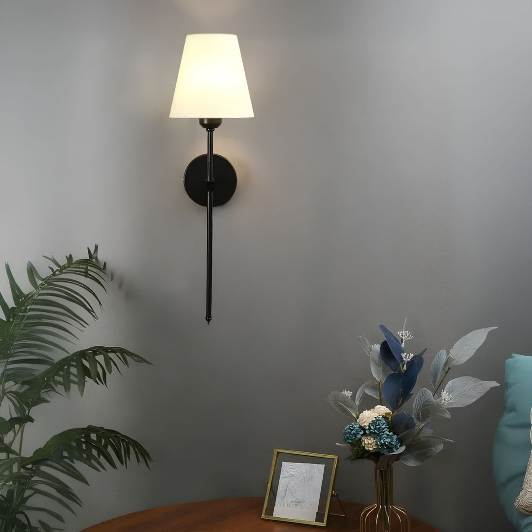 Set of two LumaElegance wireless wall lights installed in a bedroom for accent lighting.