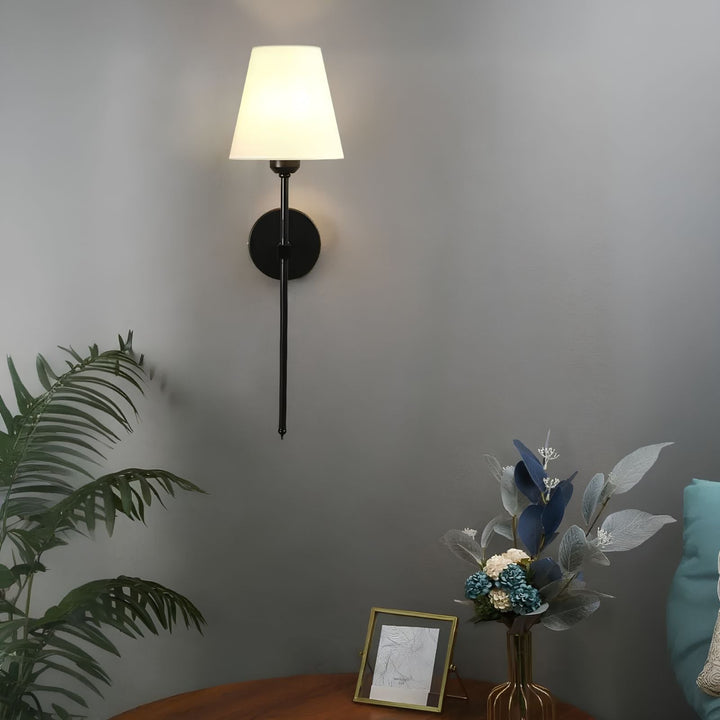 Set of two LumaElegance wireless wall lights installed in a bedroom for accent lighting.