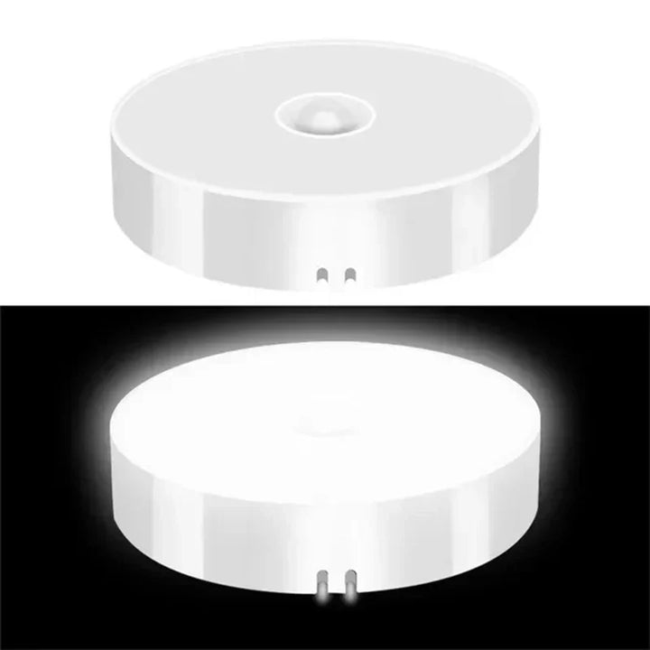 Bright white wireless LED motion sensor night light, energy-efficient for automatic home safety & stair lighting.