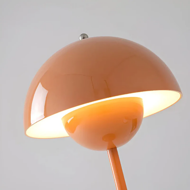 Close-up of the wireless portable table lamp's adjustable light settings and sleek base.
