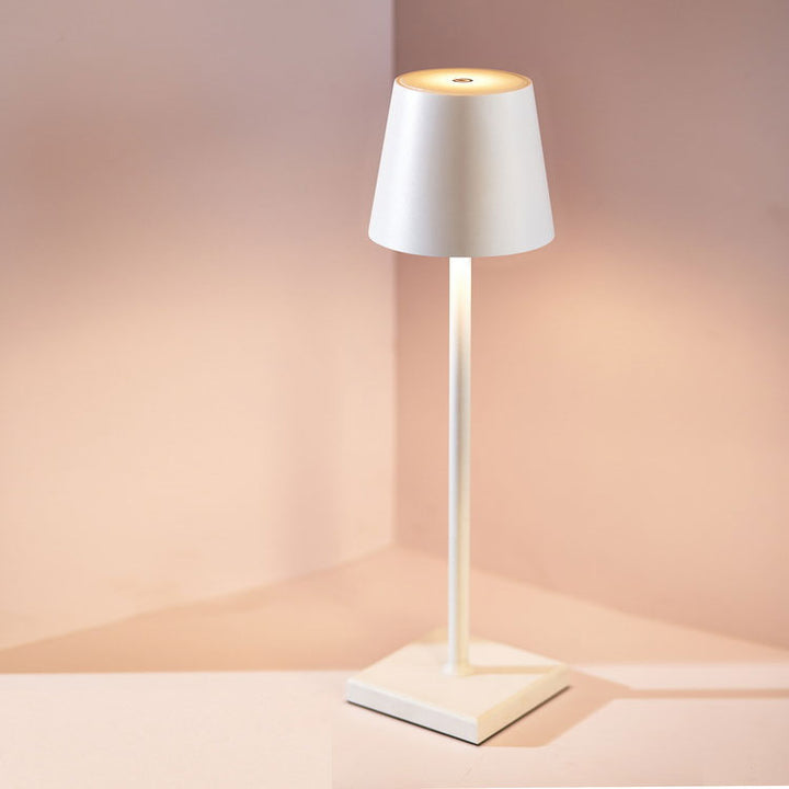 Wireless rechargeable LED table lamp creating ambient light, perfect for modern home decor.