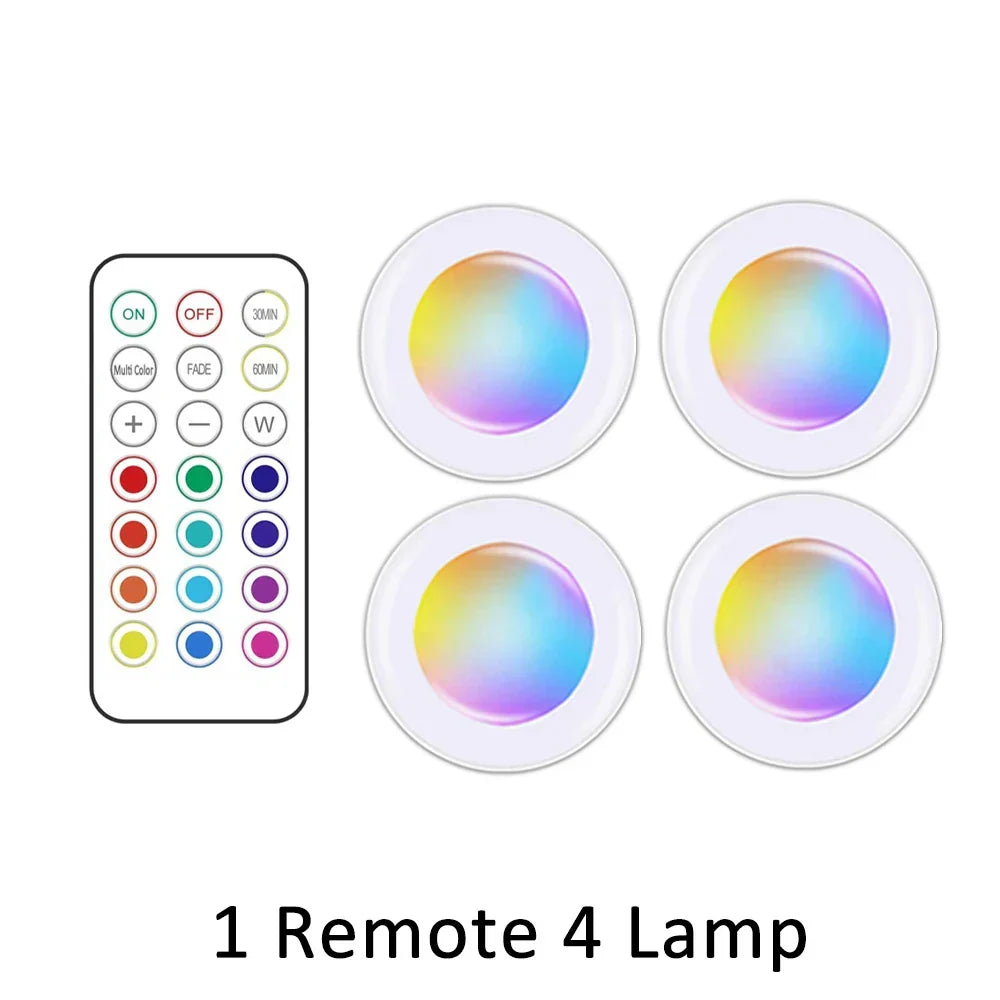 Set of wireless RGB LED under cabinet lights, battery powered & remote controlled for dynamic ambiance.