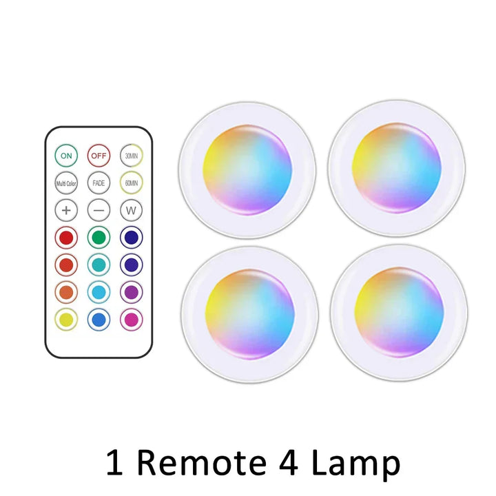 Set of wireless RGB LED under cabinet lights, battery powered & remote controlled for dynamic ambiance.