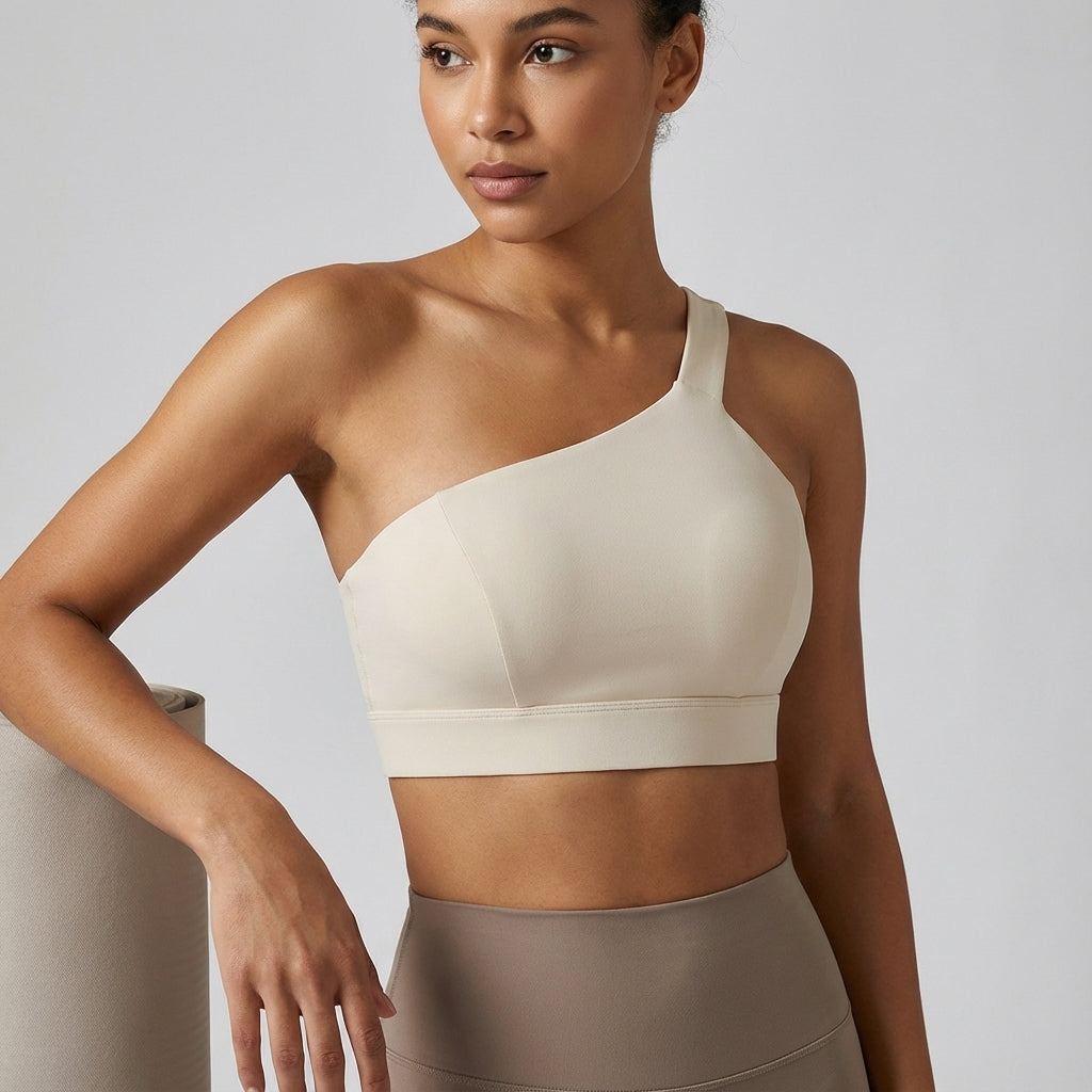 Casey breathable asymmetrical sports top for women, quick-dry activewear for fitness workouts.