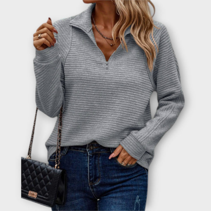 Cozy women's V-neck zipper sweater with long sleeves, perfect for comfortable fall & winter fashion.