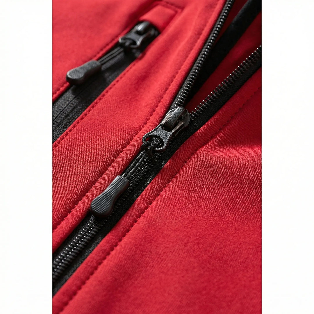Close-up of a women's hooded softshell jacket featuring a protective hood & full-zip closure for versatile wear.
