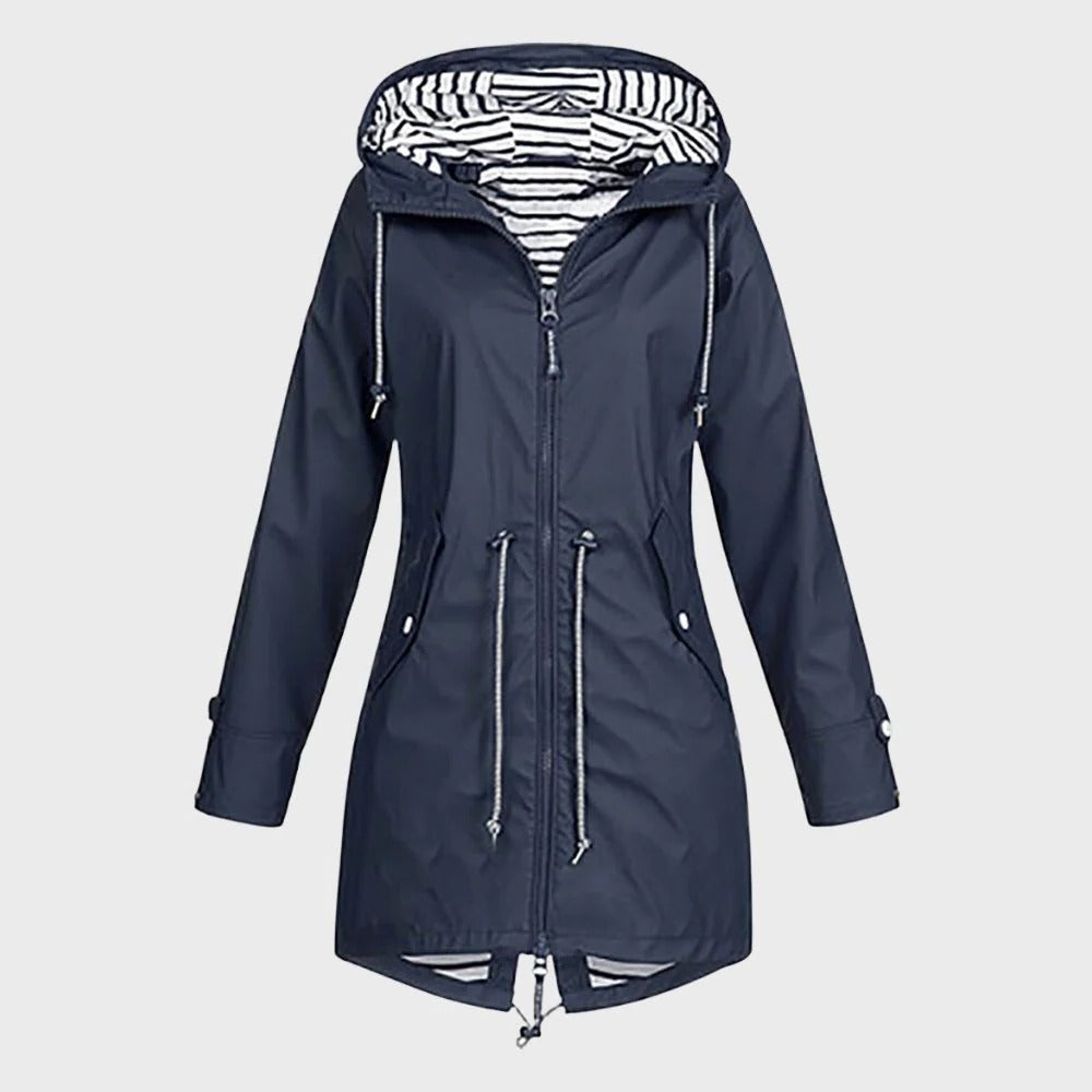 Close-up of a women's waterproof long coat, highlighting durable fabric and functional design for rain gear.