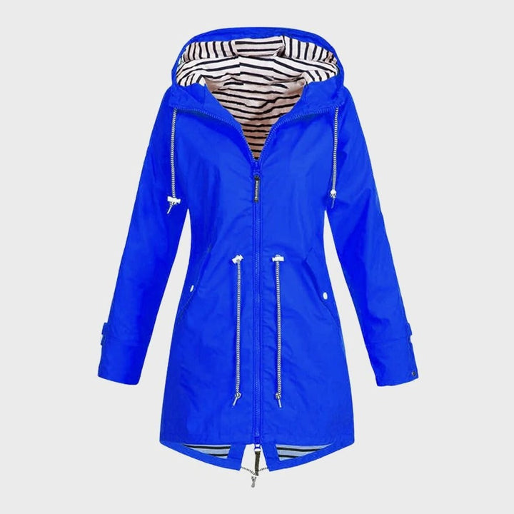 Full-length view of a women's waterproof long rain jacket, combining comfort and weather protection for outdoor adventures.
