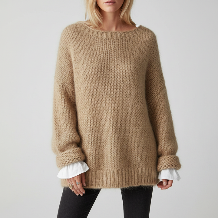 Close-up of stylish open knit oversized sweater in acrylic, ideal for spring wear.