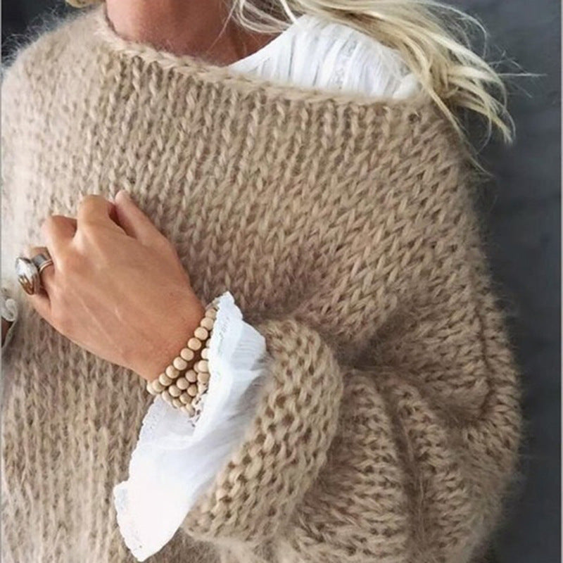 Studio shot of a women's oversized knit sweater, a comfortable acrylic jumper.