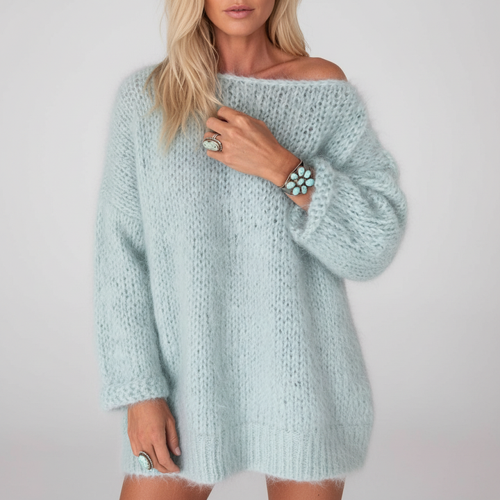 Detail of the soft texture of a women's oversized acrylic knit jumper, casual fashion.
