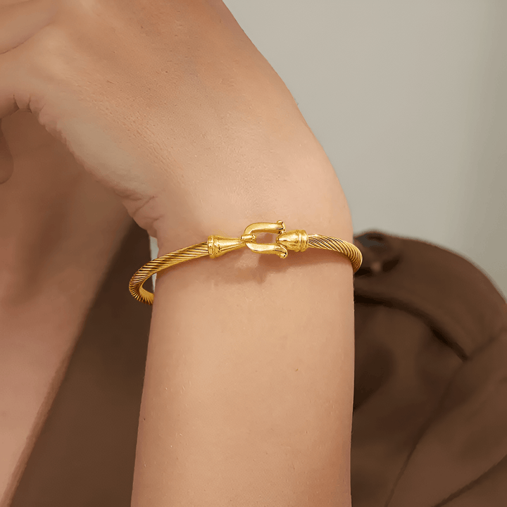 Eliana women's gold plated coil bracelet with vintage design, perfect holiday statement jewelry.