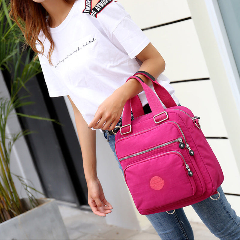 Stylish women's black nylon shoulder bag, waterproof and multifunctional, perfect for daily errands.