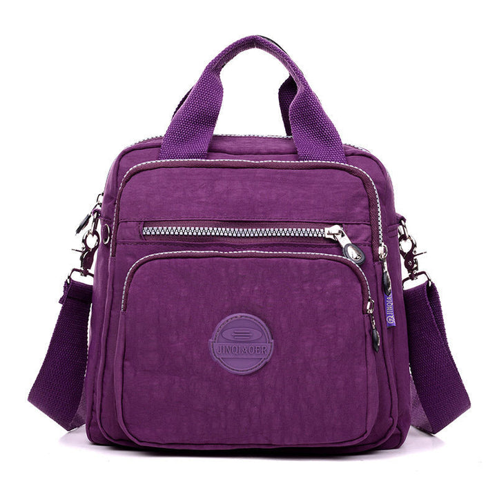 Stylish women's daily bag, waterproof & versatile, used as shoulder, crossbody or small backpack.