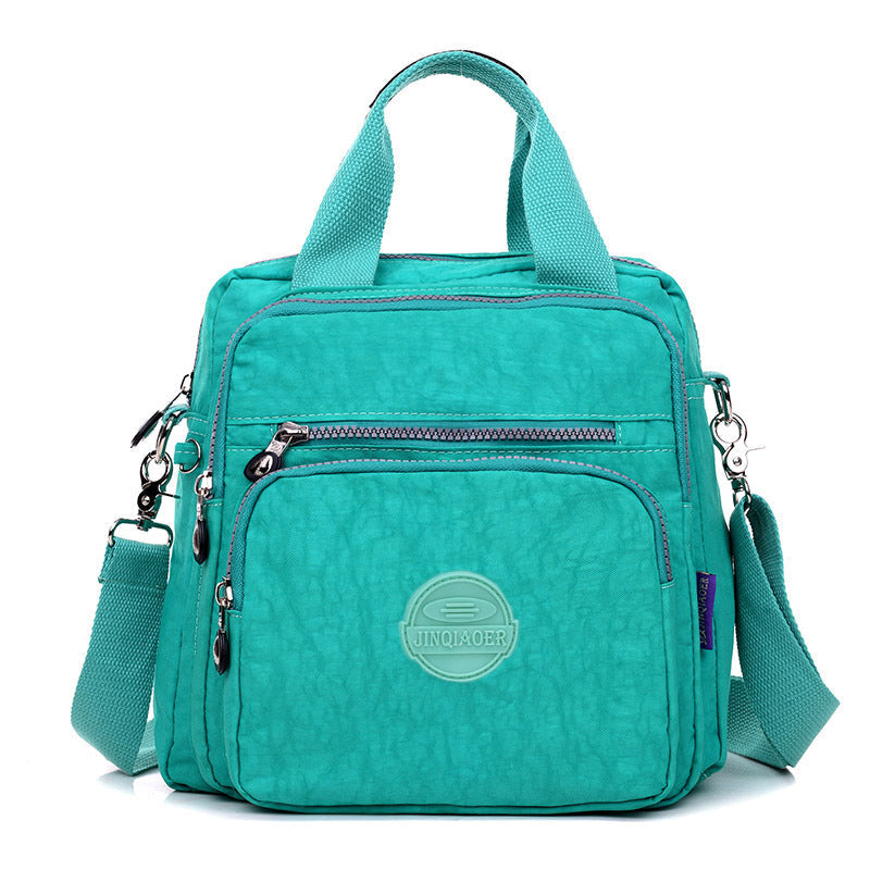 Women's waterproof crossbody bag, durable nylon, transforms into a functional shoulder bag or backpack.