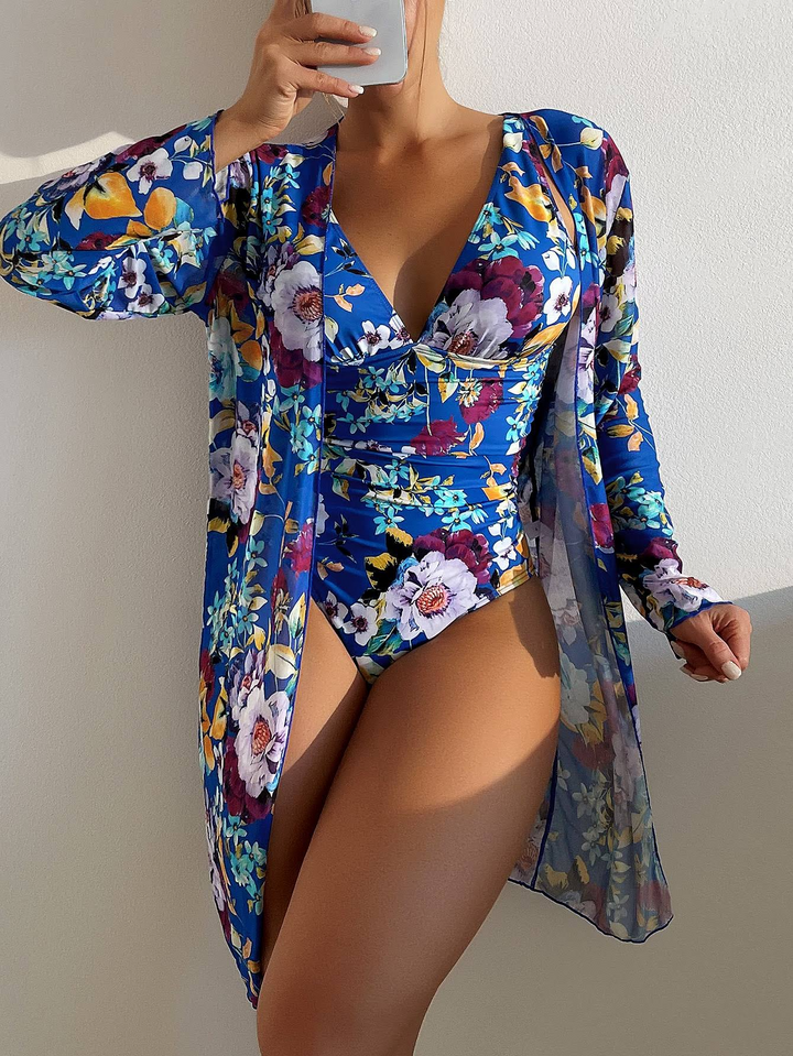 Women's 3-piece blue bikini set with top, bottoms & wrap skirt. Flattering summer swimwear for beach & pool.