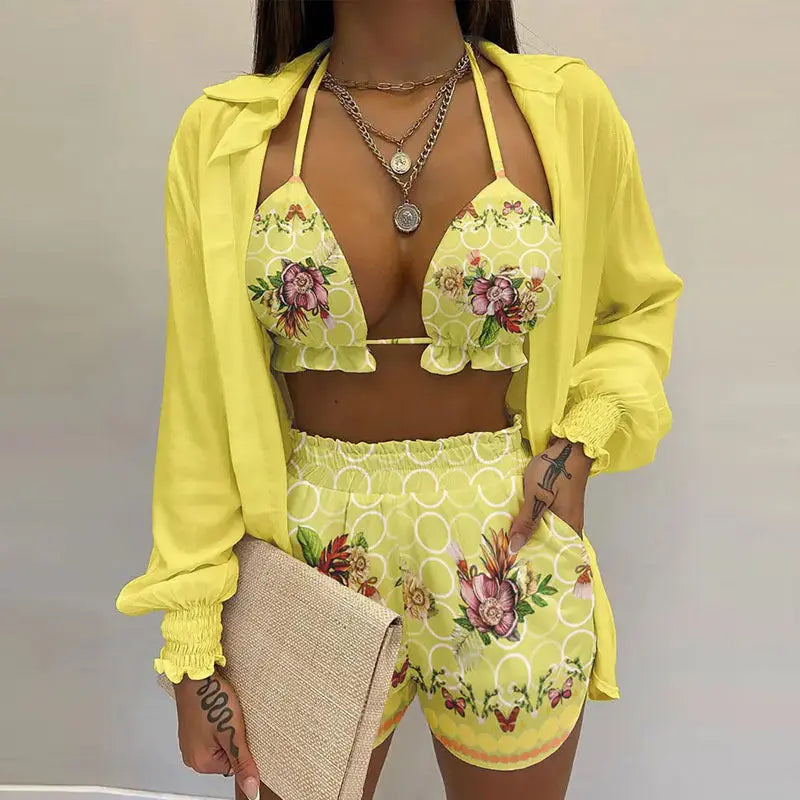 Luxurious women's 3-piece tropical swimwear. Features a supportive bikini, comfy shorts & elegant cover-up.