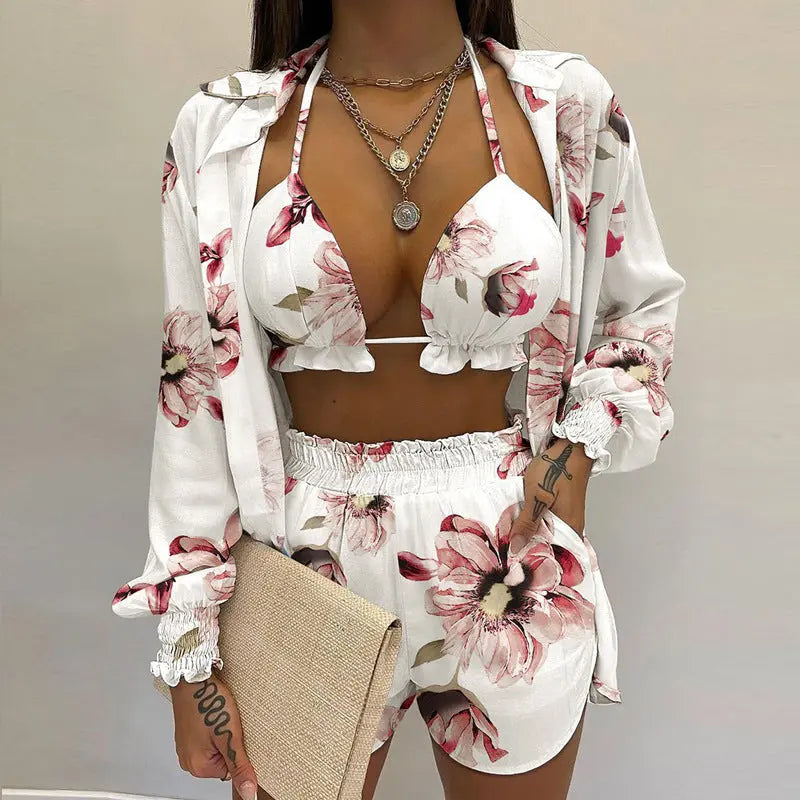 Stylish women's tropical print bikini top, matching shorts & sheer cover-up, ideal for summer vacation.