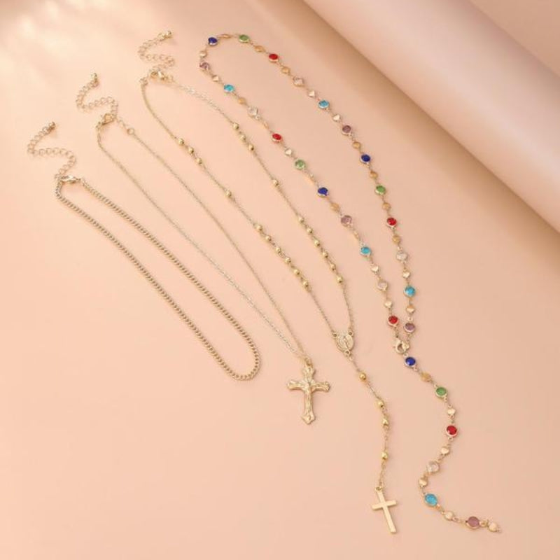 Stylish women's layered necklace set with multiple cross pendants, perfect for everyday wear or a statement piece.