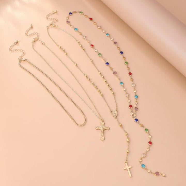 Stylish women's layered necklace set with multiple cross pendants, perfect for everyday wear or a statement piece.
