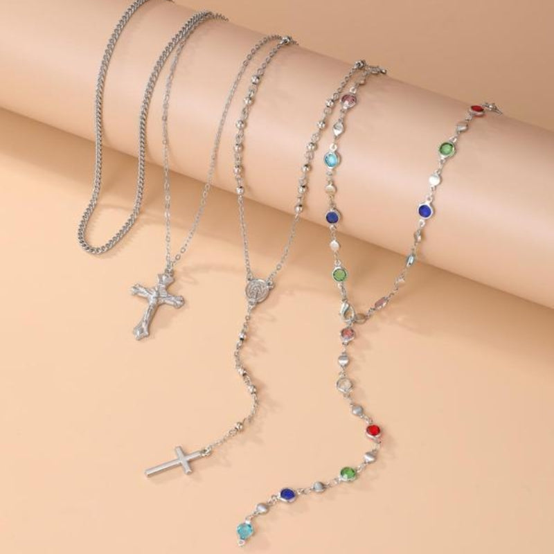 Chic women's layered cross necklace set in gold & silver tones, a versatile and trending fashion jewelry accessory.